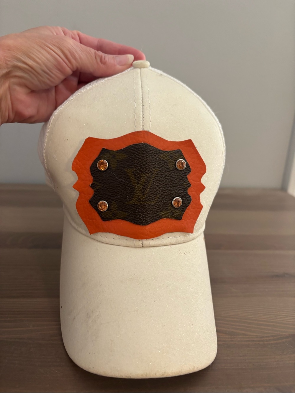 White Baseball Cap with Orange & Brown LV Patch Accent